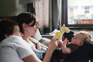 Parents playing with a baby